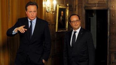 Britain's Prime Minister David Cameron (L) shows France's President Francois Hollande around the Great Room at the Chequers, during a bilateral meeting and working dinner, in London. (Reuters)