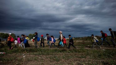 Refugees and migrants walk towards the station in Tovarnik, Croatia, Sunday, Sept. 20. (AP)