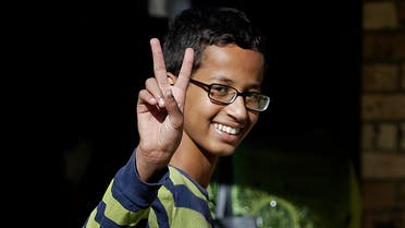  Ahmed Mohamed, 14, gestures as he arrives to his family's home in Irving, Texas, Thursday, Sept. 17, 2015. Ahmed was arrested Monday at his school after a teacher thought a homemade clock he built was a bomb. He remains suspended and said he will not return to classes at MacArthur High School. (AP Photo/LM Otero)