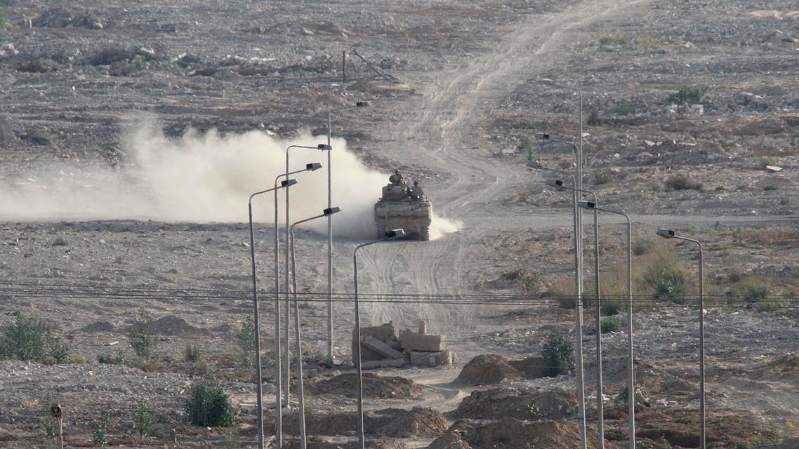 An Egyptian military personnel carrier patrols on the Egyptian side of the border between Egypt and Rafah in the southern Gaza Strip, Wednesday, July 1, 2015. AP