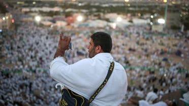 A Muslim pilgrim takes a photo with his mobile phone from atop a rocky hill called the Mountain of Mercy, on the Plain of Arafat, near the holy city of Mecca, Saudi Arabia, Wednesday, Sept. 23, 2015. AP 