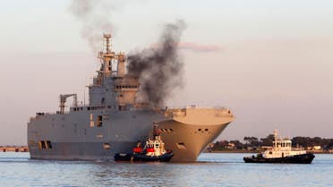 In this March 5, 2014 file photo, French-built warship BPC Vladivostock, designed to strengthen Russia's ability to deploy troops, tanks and helicopter gunships, leaves the Saint Nazaire's harbor, western France. France says Wednesday Sept.23, 2015 AP 