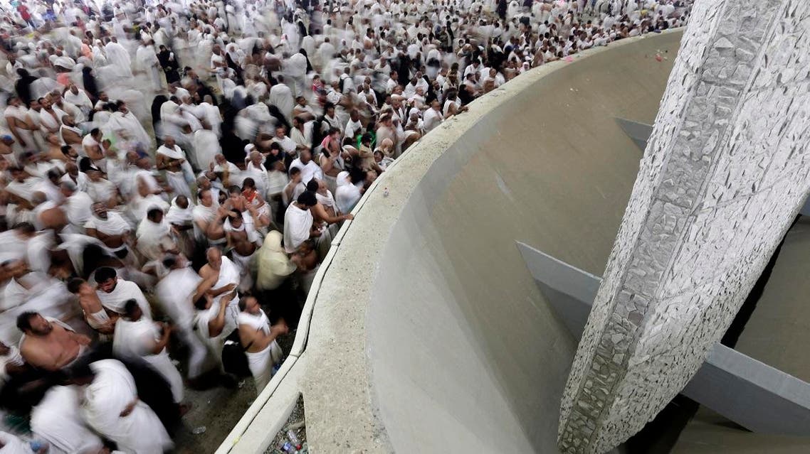 Muslim pilgrims cast stones at a pillar, symbolizing the stoning of Satan, in a ritual called "Jamarat," a rite of the annual hajj, the Islamic faith's most holy pilgrimage, in Mina near the Saudi holy city of Makkah. (File photo: AP)