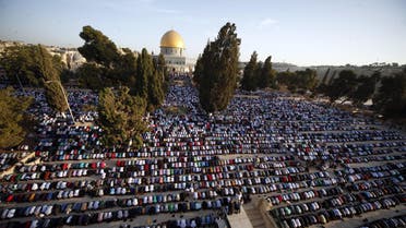  Palestinians pray during the Muslim holiday of Eid al-Adha, near the Dome of the Rock Mosque in the Al Aqsa Mosque compound in Jerusalem's old city, Thursday, Sept. 24, 2015. Muslims will slaughter cattle and goats later, with the beef and meat distributed to the needy in the holiday which honors the prophet Abraham for preparing to sacrifice his son on the order of God, who was testing his faith. (AP Photo/Mahmoud Illean)