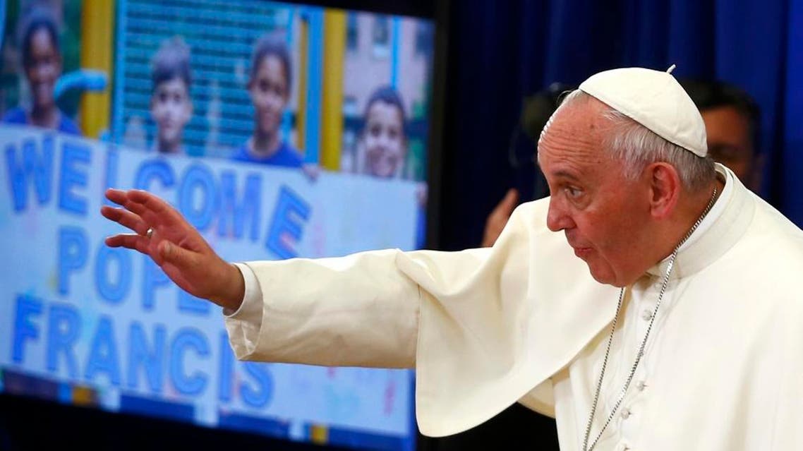 Pope Francis waves as he visits Our Lady Queen of Angels School in East Harlem in New York, September 25, 2015. (Reuters)