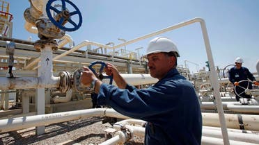 In this May 31, 2009 file photo, an employee works at the Tawke oil fields in the semiautonomous Kurdish region in northern Iraq. Iraq's self-ruled northern Kurdish region said Friday that it has made its first oil shipment through its own pipeline to the international market, bypassing the central government in Baghdad, which insists that it has the sole right to develop and market the country's natural resources. (AP Photo/Hadi Mizban, File)