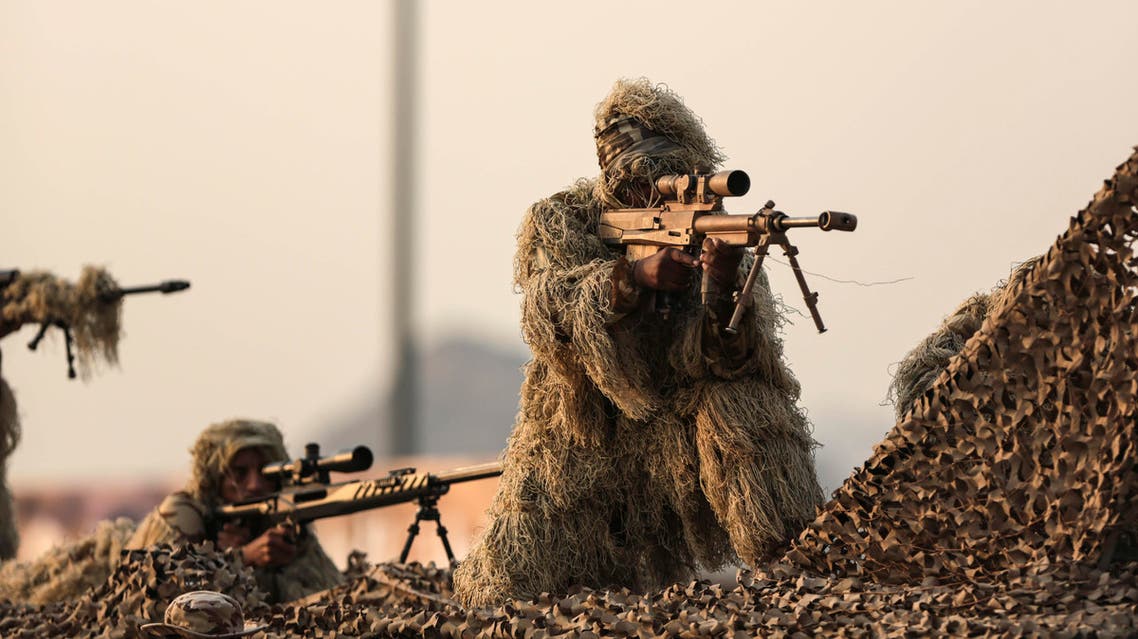 Saudi security forces take part in a military parade AP