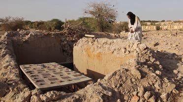 In this Friday, April 4, 2014 file photo, Mohamed Maouloud Ould Mohamed, a mausoleum caretaker, prays at a damaged tomb in Timbuktu, Mali. In the West African nation of Mali, Islamic radicals in 2012 overran Timbuktu, the historic city of Islamic culture. ap