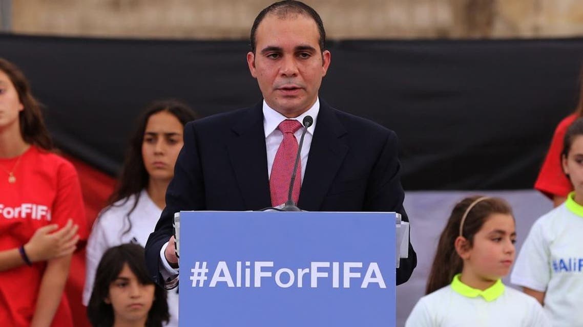 Jordan's Prince Ali bin al-Hussein, flanked by school-age soccer players in uniforms, speaks before about 300 guests during an event at a Roman amphitheater in Amman, Jordan, Wednesday, Sept. 9, 2015. The prince is running for FIFA president, saying Wednesday he will fight "deep-seated corruption and political deal-making" and make soccer's scandal-scarred governing body more transparent. (AP Photo/Raad Adayleh)