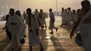 Muslim pilgrims arrive to cast stones at pillars symbolizing Satan during the annual haj pilgrimage in Mina on the first day of Eid al-Adha, near the holy city of Mecca