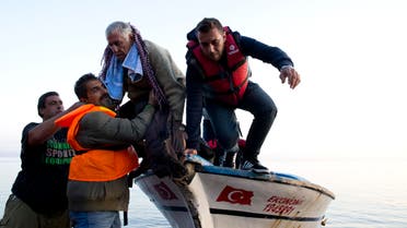  Syrian refugees arrive on a fishing boat from Turkey on the shores of the Greek island of Lesbos , Sunday Sept. 27, 2015. More than 260,000 asylum-seekers have arrived in Greece so far this year, most reaching the country's eastern islands on flimsy rafts or boats from the nearby Turkish coast.(AP Photo/Petros Giannakouris)