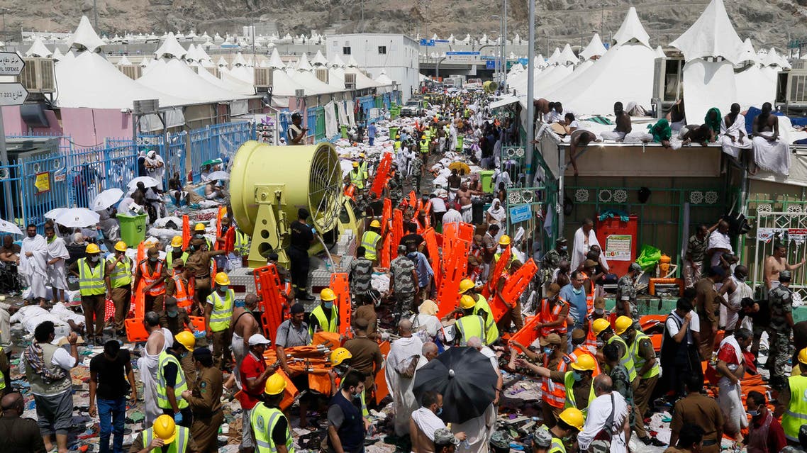 Muslim pilgrims and rescuers gather around people who died in Mina, Saudi Arabia during the annual hajj pilgrimage on Thursday, Sept. 24, 2015. AP