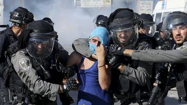 Israeli border policemen detain a Palestinian protester during clashes in Shuafat refugee camp near Jerusalem. (File photo: Reuters)