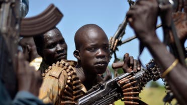  South Sudan government soldiers in the town of Koch, Unity state, South Sudan, Friday, Sept. 25, 2015. The regional bloc that mediated South Sudan's peace agreement says both sides have violated the deal signed last month. (AP Photo/Jason Patinkin)
