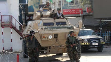 Afghan soldiers keep watch during a battle with the Taliban in Kunduz Province, Afghanistan September 28, 2015. Afghan Taliban fighters on Monday seized control of a 200-bed hospital in Kunduz city in the north, a spokesman for the militants said.The Taliban launched a fierce offensive from three directions on Kunduz just after dawn, raising fresh fears parts of the provincial capital could fall into their hands. REUTERS/Stringer