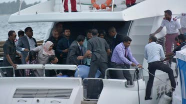 Unidentified injured people are evacuated after a blast on the Maldives President Yameen Abdul Gayoom speedboat in Male. (AP)