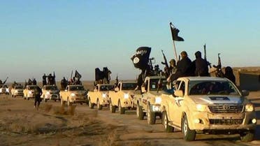 In this undated file photo released by a militant website, which has been verified and is consistent with other AP reporting, militants of the Islamic State group hold up their weapons and wave its flags on their vehicles in a convoy on a road leading to Iraq, while riding in Raqqa city in Syria. When world leaders convene for the U.N. General Assembly debate Monday, Sept. 28, 2015, it will be a year since the U.S. president declared the formation of an international coalition to "degrade and ultimately destroy" the Islamic State group. Despite billions of dollars spent and thousands of airstrikes, the campaign appears to have made little impact. (Militant website via AP, File)