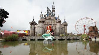 Banksy to send timbers from ‘dismaland’ theme park to refugees