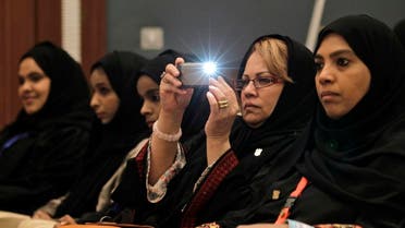 A woman uses her mobile phone to takes a picture during the Gulf youth conference in Riyadh. (File photo: AP)
