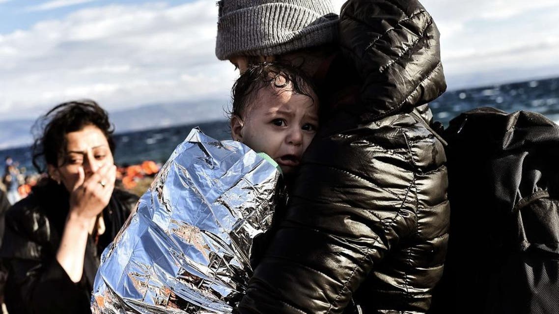 Refugees and migrants arrive at the Greek island of Lesbos after crossing the Aegean sea from Turkey on September 30, 2015. AFP