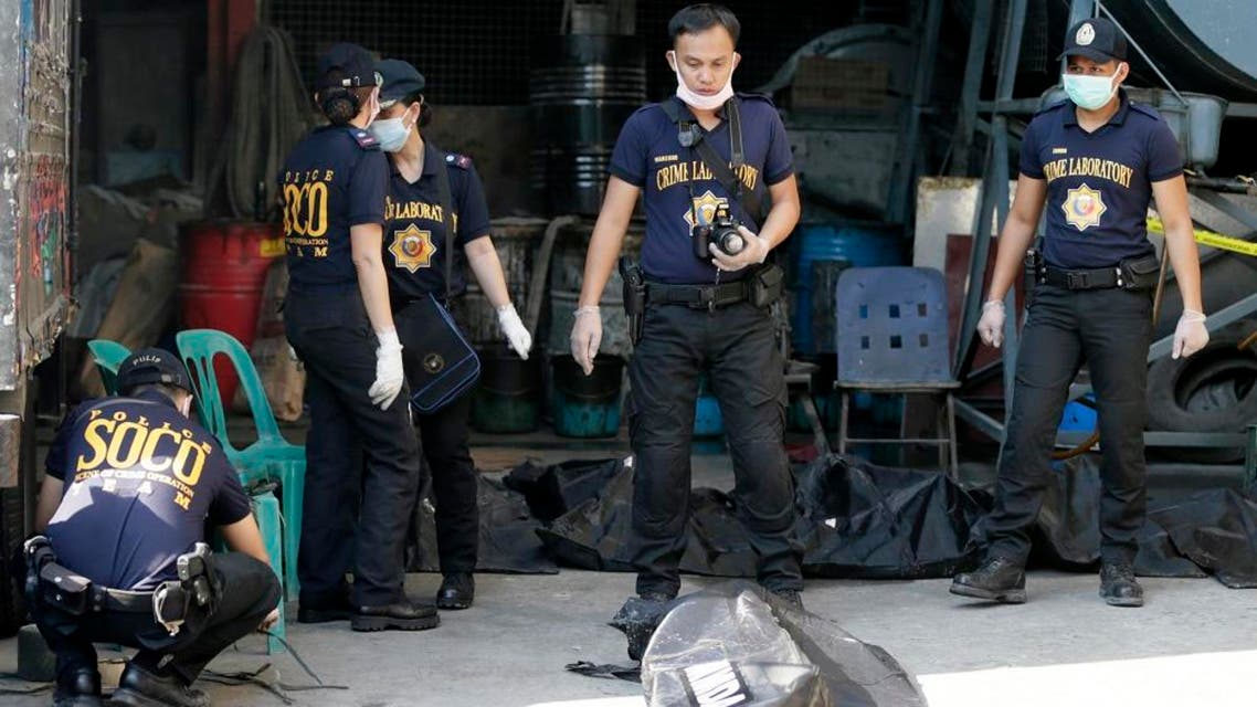 Scene of the Crime Operatives of the Philippine National Police in Valenzuela city, a northern suburb of Manila, Philippines, Thursday, May 14, 2015. (AP)