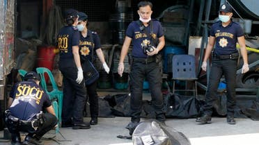Scene of the Crime Operatives of the Philippine National Police in Valenzuela city, a northern suburb of Manila, Philippines, Thursday, May 14, 2015. (AP)