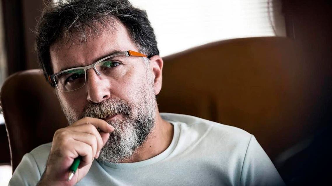 In this 2015 file photo, Ahmet Hakan Coskun, a Hurriyet newspaper journalist, as he listens during an interview in Istanbul, Turkey. ap