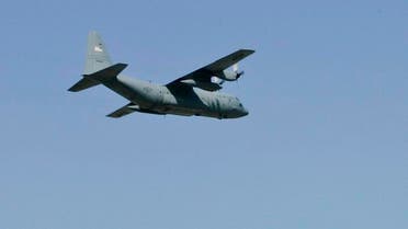 One of the last three C-130 Hercules military cargo planes fly over the hanger and out of Will Rogers Air National Guard Base in Oklahoma City, Thursday, Sept. 20, 2007. (File photo: AP)
