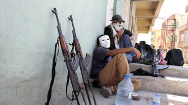 Masked members of YDG-H, youth wing of the outlawed Kurdistan Workers Party (PKK), sit next to their weapons in Silvan, near the southeastern city of Diyarbakir, Turkey, in this August 17, 2015 file photo. Young, urban-based fighters, many of them still teenagers, have taken centre-stage in the conflict between Kurdish militants and Turkish security forces that has flared anew in southeast Turkey since a two-year ceasefire fell apart in July. The intensity of the violence recalls for some the 1990s, when the insurgency waged by the PKK was at its peak and thousands were being killed annually, though the death toll remains for now well below those levels. The fighters from the PKK's youth wing, known as the 'Patriotic Revolutionary Youth Movement' (YDG-H), attack security forces in cities and towns with heavy weapons, dig trenches and erect barricades down side streets. REUTERS/Sertac Kayar/Files