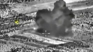 A frame grab taken from footage released by Russia's Defence Ministry October 3, 2015, shows smoke rising after airstrikes carried out by Russian air force on what Russia says was a bomb factory in Maarat al-Numan, south of the town of Idlib, Syria.  (Reuters