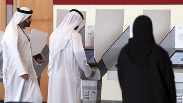  Emiratis cast their vote at a polling centre in the Gulf emirate of Umm al Qaiwain on October 3, 2015 (AFP)