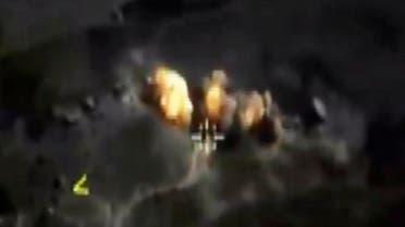 In this photo made from the footage taken from Russian Defense Ministry official web site on Saturday, Oct. 3, 2015 a bomb explosion is seen in Syria. AP