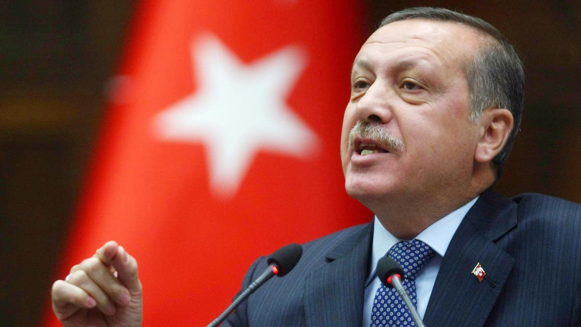 Turkey's Prime Minister Recep Tayyip Erdogan addresses lawmakers and supporters of his party at the parliament in Ankara, Turkey, Tuesday, Feb. 8, 2011.