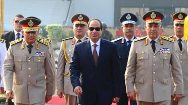 Egyptian President Abdel Fattah al-Sisi (C), Defense Minister Sedki Sobhi and Chief of Staff Mahmoud Hegazy visit a memorial in commemoration of the 1973 October War, in Cairo, Egypt, October 4, 2015. (Reuters)