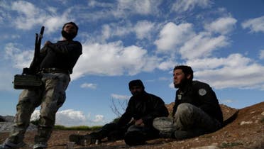 Rebel fighters from the Ahrar al-Sham Islamic Movement sit near Morek in the northern countryside of Hama March 16, 2015. (Reuters)