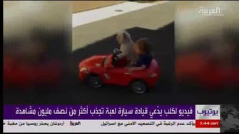 Viral video: Dog drives baby in toy car