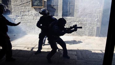 Israeli border policemen fire tear gas during a confrontation in the Old City of Jerusalem. (File photo: AP)