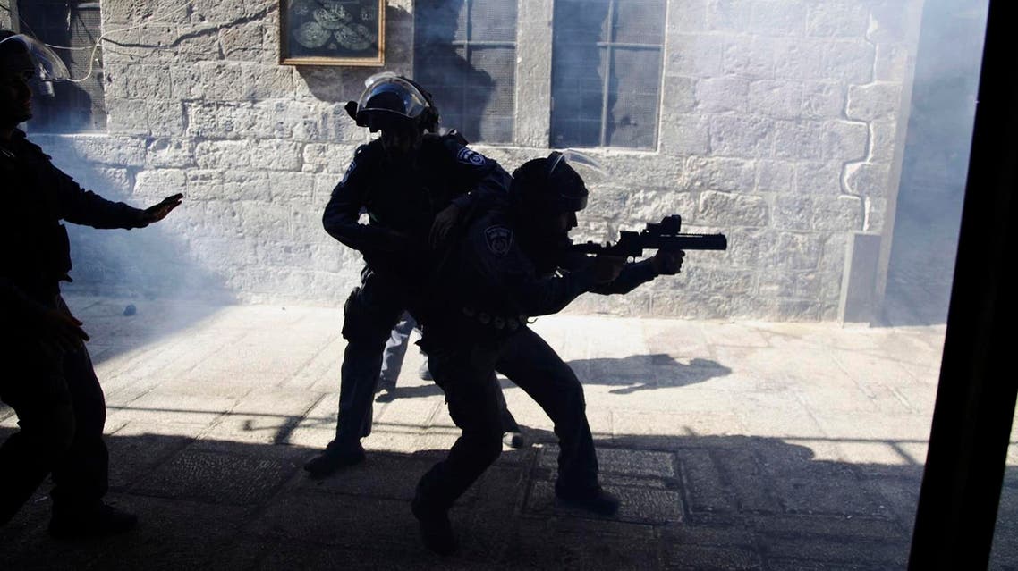 Israeli border policemen fire tear gas during a confrontation in the Old City of Jerusalem. (File photo: AP)
