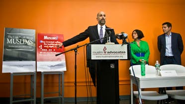 Muslim Advocates Legal Director Glenn Katon, left, and Muslim comedians Negin Farsad, center, and Dean Obeidallah, right, hold a press conference about a lawsuit challenging the Metropolitan Transportation Authority's refusal to run comedic ads about American Muslims like those displayed. (AP)