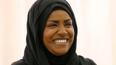 "The Great British Bake Off" TV show winner Nadiya Hussain smiles as she poses for photographers in London, Thursday, Oct. 8, 2015.  AP