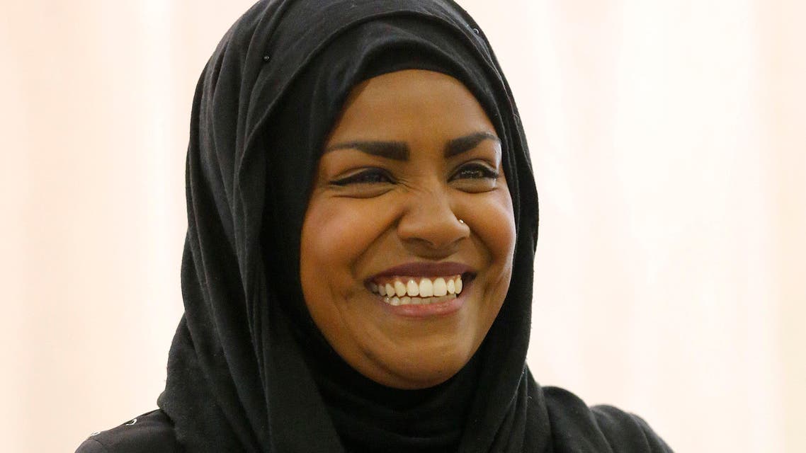 "The Great British Bake Off" TV show winner Nadiya Hussain smiles as she poses for photographers in London, Thursday, Oct. 8, 2015. AP