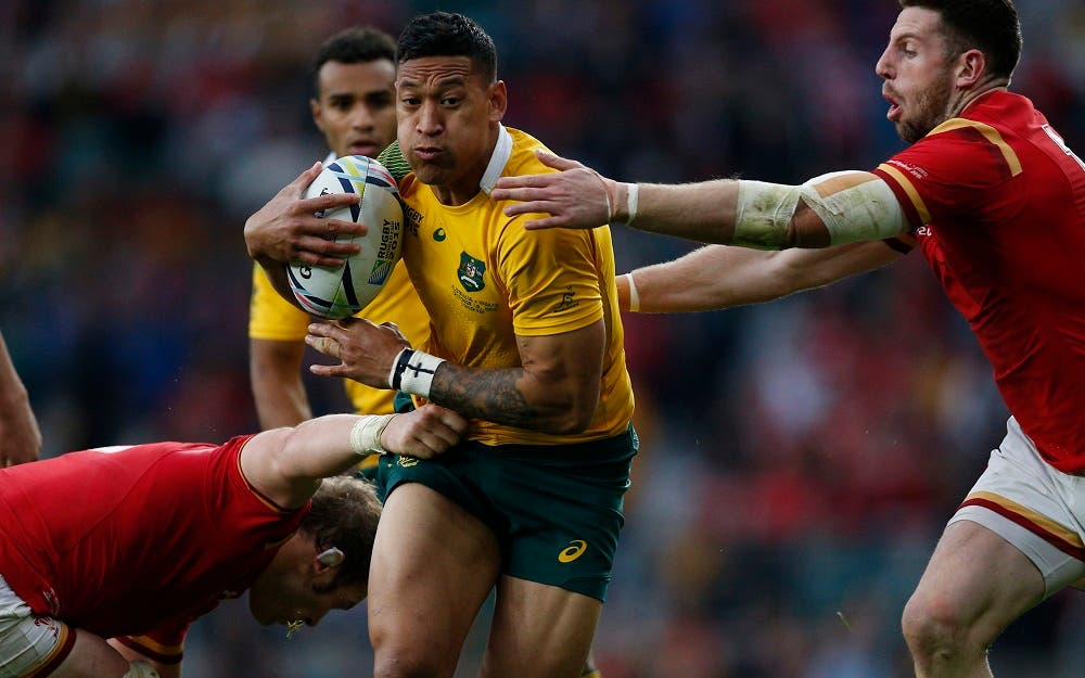 Australia's Israel Folau is tackled by the Wales defence during the Rugby World Cup Pool A match between Australia and Wales at Twickenham Stadium, London, Saturday, Oct. 10, 2015. (AP Photo/Christophe Ena)