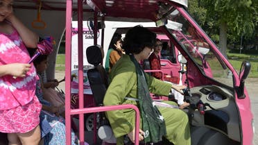Pakistani women prepare to drive pink auto-rickshaws during a rally in Lahore on October 10, 2015. AFP