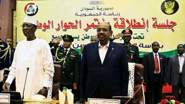 Sudan's President Omar al-Bashir and Chad's President Idriss Deby (L) listen to the national anthem during opening session of Sudan National Dialogue conference in Khartoum October 10, 2015. (Reuters)