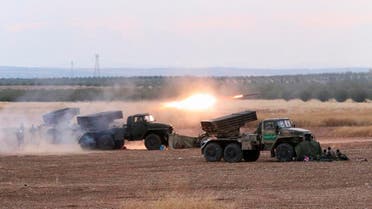In this photo taken on Wednesday, Oct. 7, 2015, Syrian army rocket launchers fire near the village of Morek in Syria. The Syrian army has launched an offensive this week in central and northwestern Syria aided by Russian airstrikes. (AP Photo/Alexander Kots, Komsomolskaya Pravda, Photo via AP)