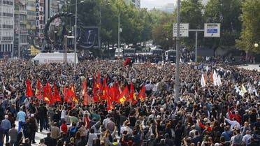 People gather in a square during a commemoration for the victims of Saturday's bomb blasts in the Turkish capital, in Ankara, Turkey, October 11, 2015. Turkish investigators worked on Sunday to identify the perpetrators and victims of Saturday's bomb blasts which killed at least 95 people in the capital Ankara, while Turks mourned the most deadly attack of its kind on Turkish soil. REUTERS/Umit Bektas