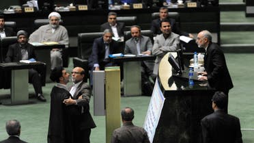    TEH001 - Tehran, -, IRAN : Iran's head of Atomic Energy Organisation (IAEO) Ali Akbar Salehi (R) argues with a member of parliament during a session in Tehran on October 11, 2015. Iran's parliament gave a partial nod to a nuclear deal with world powers Sunday but only after fiery clashes and allegations from a top negotiator that a lawmaker had threatened to kill him. AFP PHOTO / ISNA / AMIN KHOROSHAHI