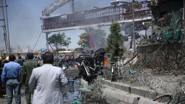 Afghan security forces inspect the site of an attack at the main gate of International Hamed Karzai Airport in Kabul, Afghanistan, Monday, Aug. 10, 2015. (AP)