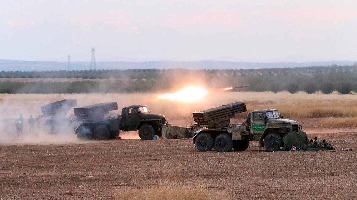 In this photo taken on Wednesday, Oct. 7, 2015, Syrian army rocket launchers fire near the village of Morek in Syria. The Syrian army has launched an offensive this week in central and northwestern Syria aided by Russian airstrikes. (AP Photo/Alexander Kots, Komsomolskaya Pravda, Photo via AP)