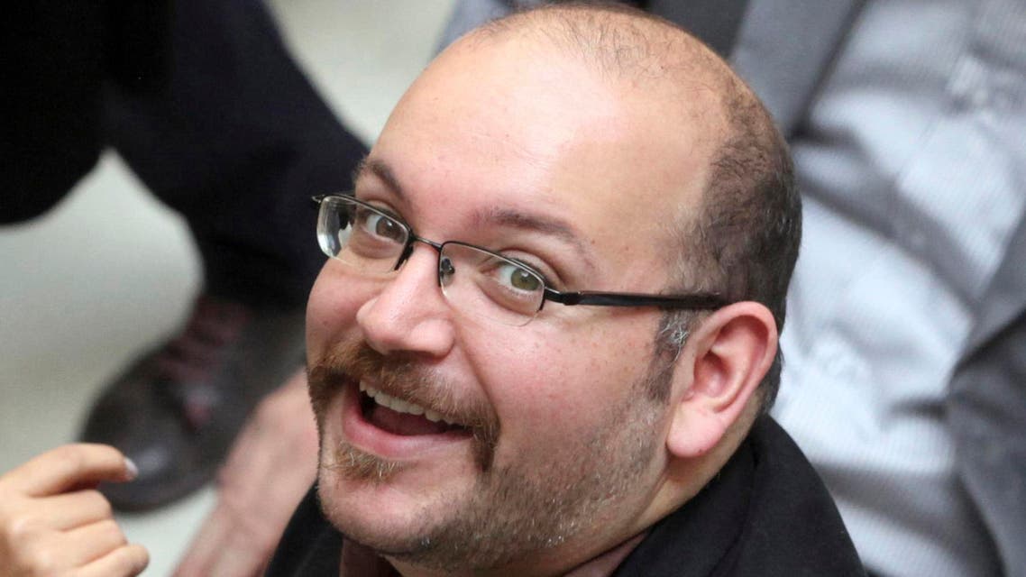 In this photo April 11, 2013 file photo, Jason Rezaian, an Iranian-American correspondent for the Washington Post, smiles as he attends a presidential campaign of President Hassan Rouhani in Tehran, Iran.